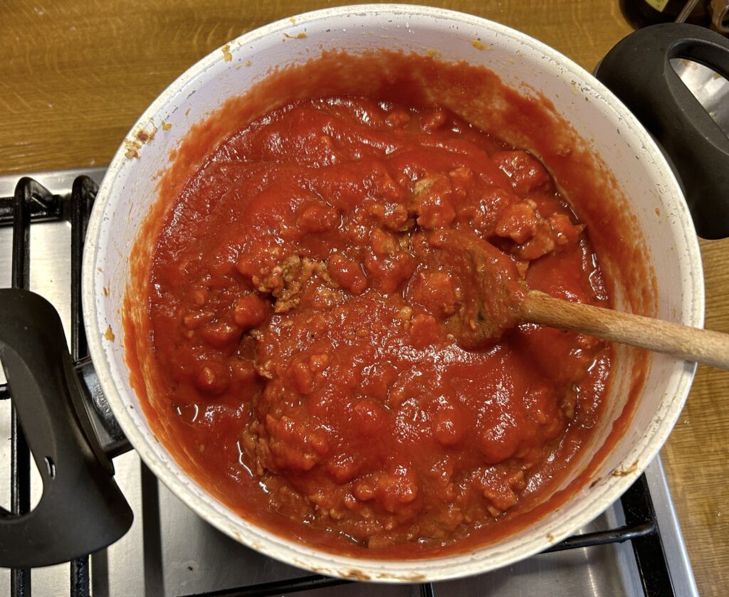 add the tomato puree