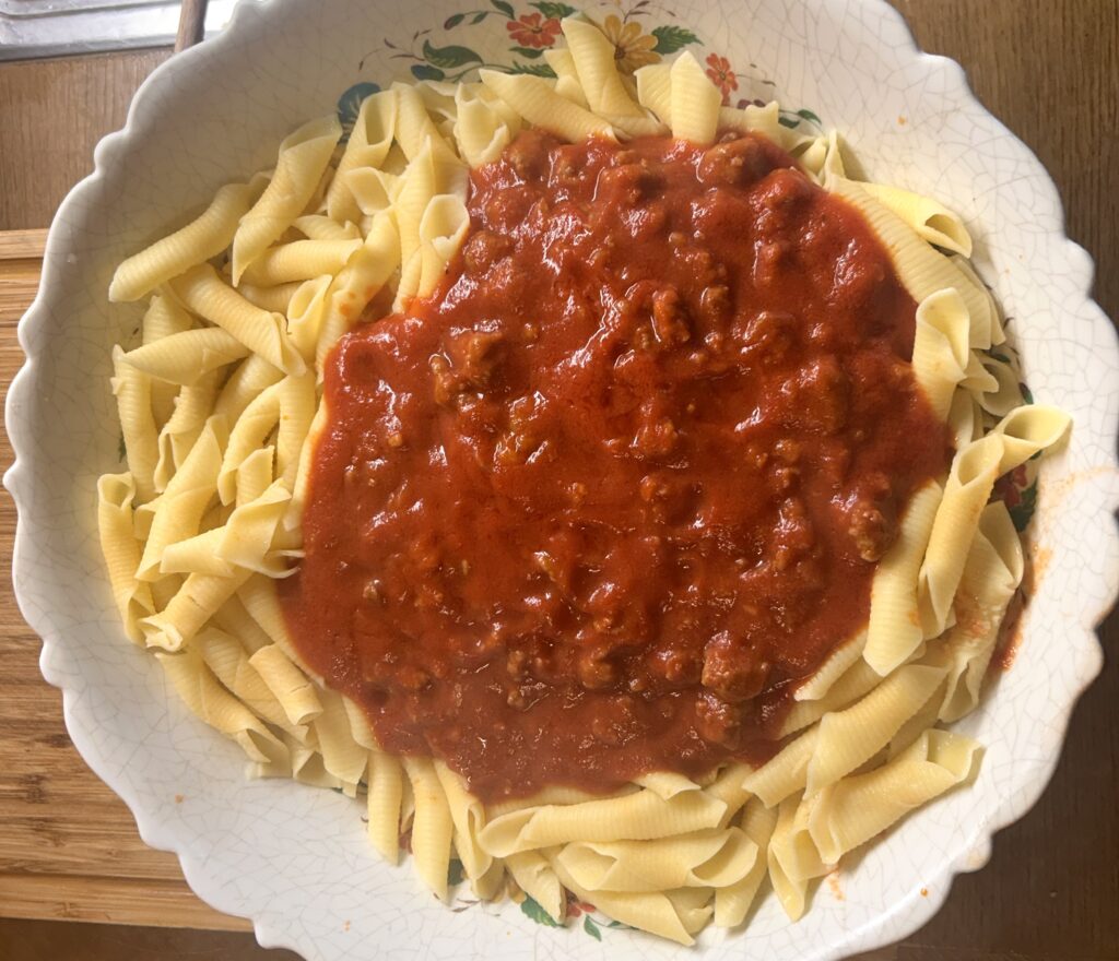 mix macaroni with sausage sauce