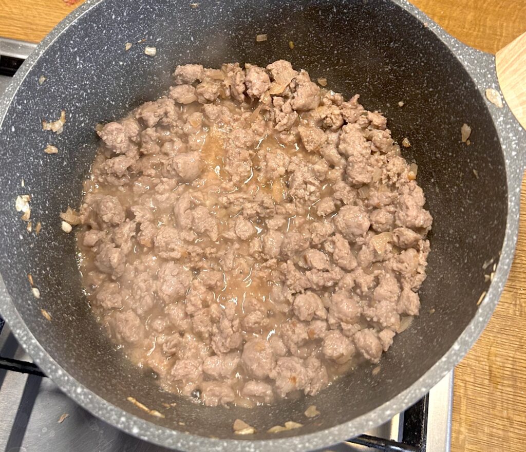 sauté onion and sausage